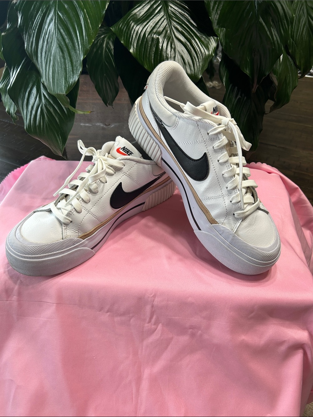 Nike Women's White Sneakers with Black Swoosh and Gold Trim Size 9